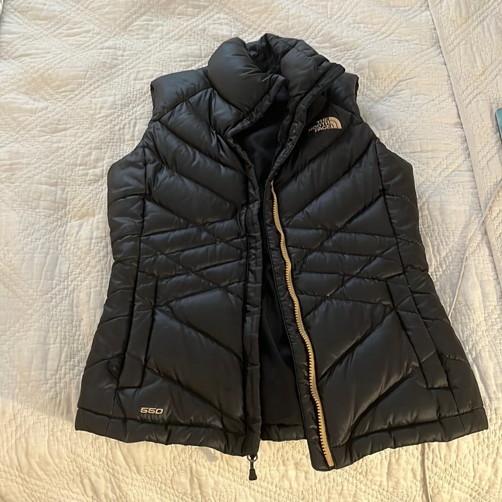 North face black and gold vest